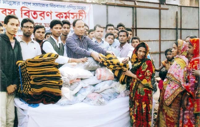 Firingibazar Nobin Ekota Sangha distributed winter clothes among the cold-hit people in Narayanganj recently.