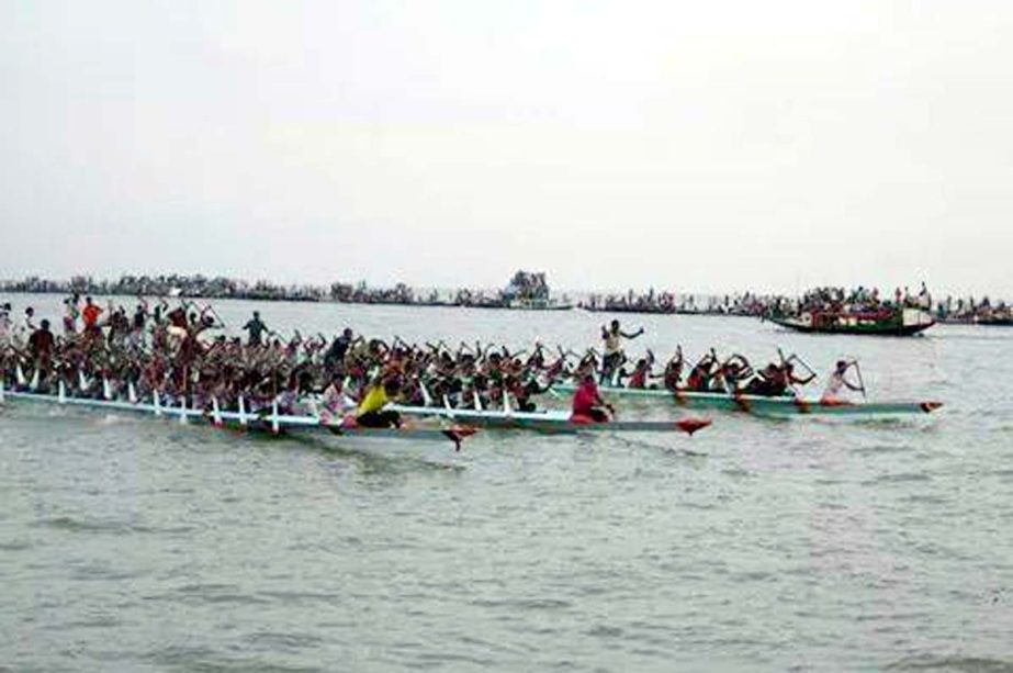 A scene from the boat race in the Gorauttara river in Nikli upazila of Kishoreganj district on Monday. Nikli Upazila Parishad arranged the traditional boat race. Thousands of spectators watched the boat race. Md Afzal Hossain, MP distributed the prizes am