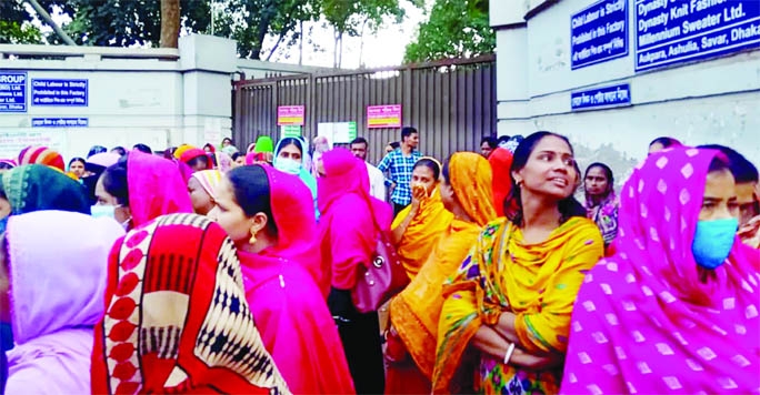 Workers of Dynasty Sweater (BD) Ltd stage a demonstration in front of the factory in the capital on Thursday, demanding reopening of the factory.